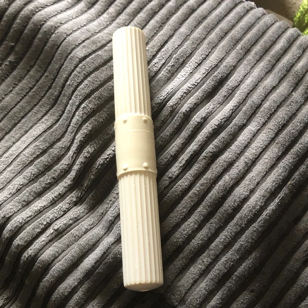 White Ribbed Plastic Roller Tool tooth brush container